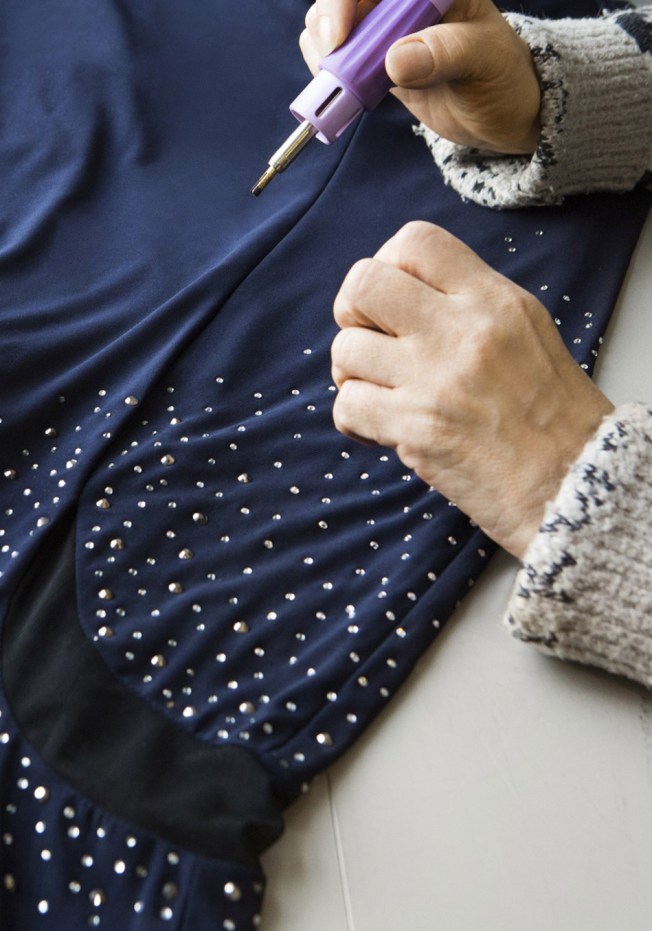 adding Swarovski Crystals on Opra's gown